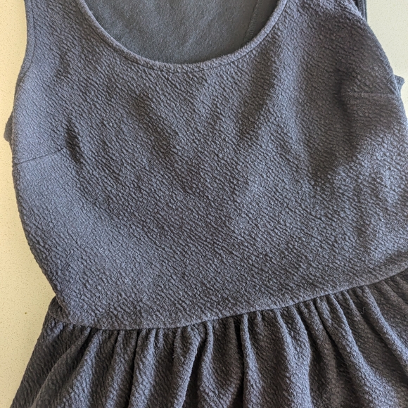 Chic Black Sleeveless Peplum Top - Picture 6 of 6